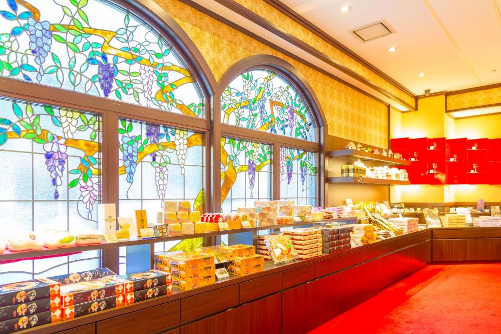 a store with stained glass windows in a building at Kanazawa Hakuchoro Hotel Sanraku -Natural Hot Spring- in Kanazawa