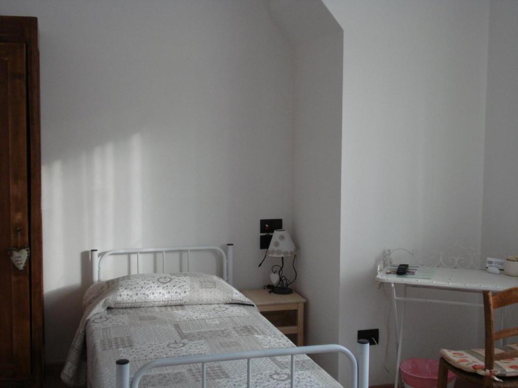 Postel nebo postele na pokoji v ubytování Ai Pianai