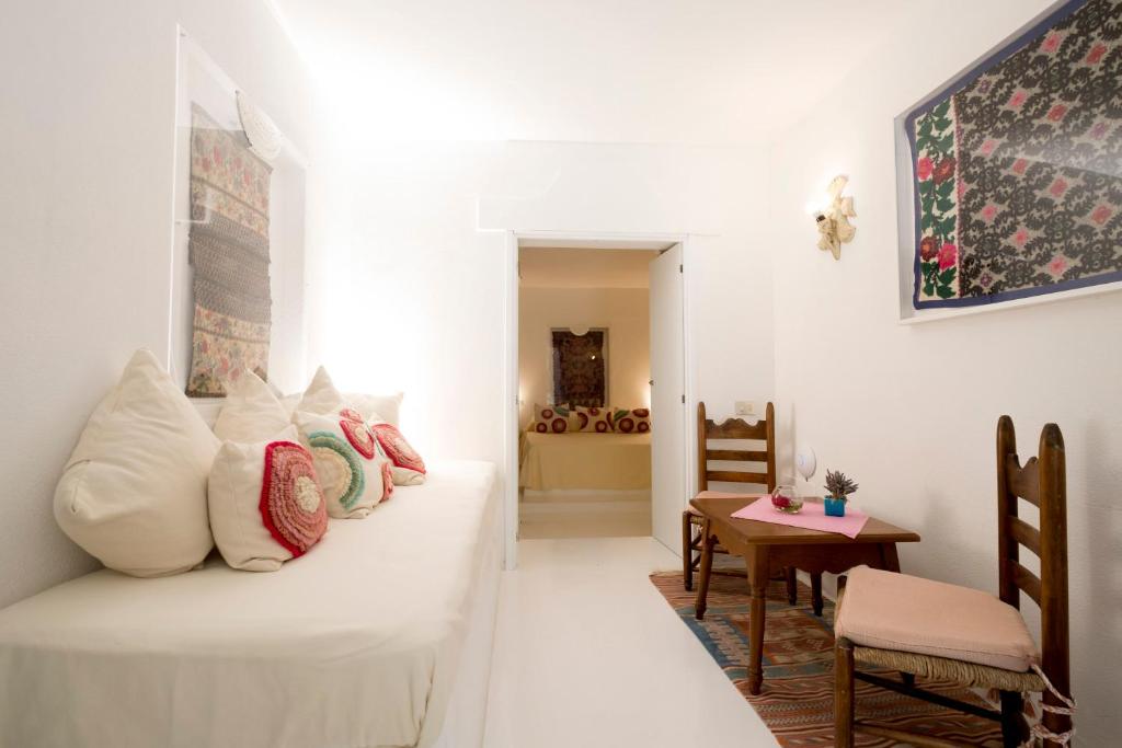 Postel nebo postele na pokoji v ubytování Su Gologone Experience Hotel