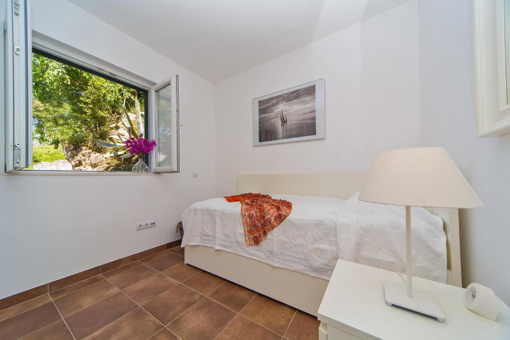 Posteľ alebo postele v izbe v ubytovaní I Sassi Bianchi - West Villa