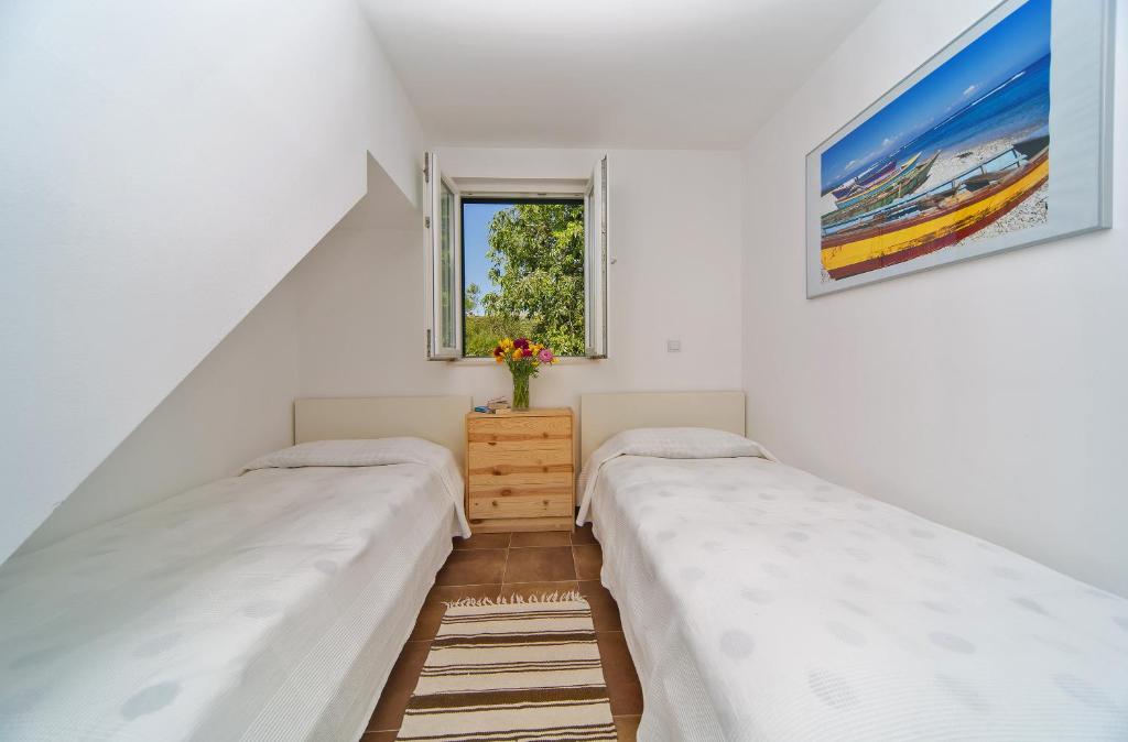 Posteľ alebo postele v izbe v ubytovaní I Sassi Bianchi - West Villa
