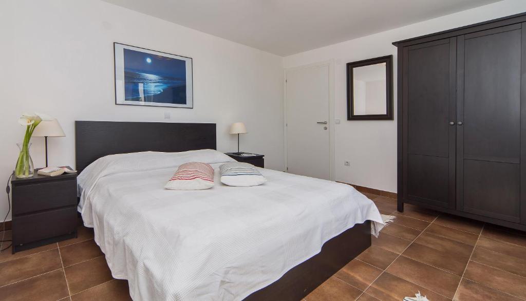 Ein Bett oder Betten in einem Zimmer der Unterkunft I Sassi Bianchi - East Villa