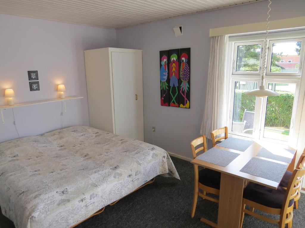Postel nebo postele na pokoji v ubytování Motel Garni Blåvand