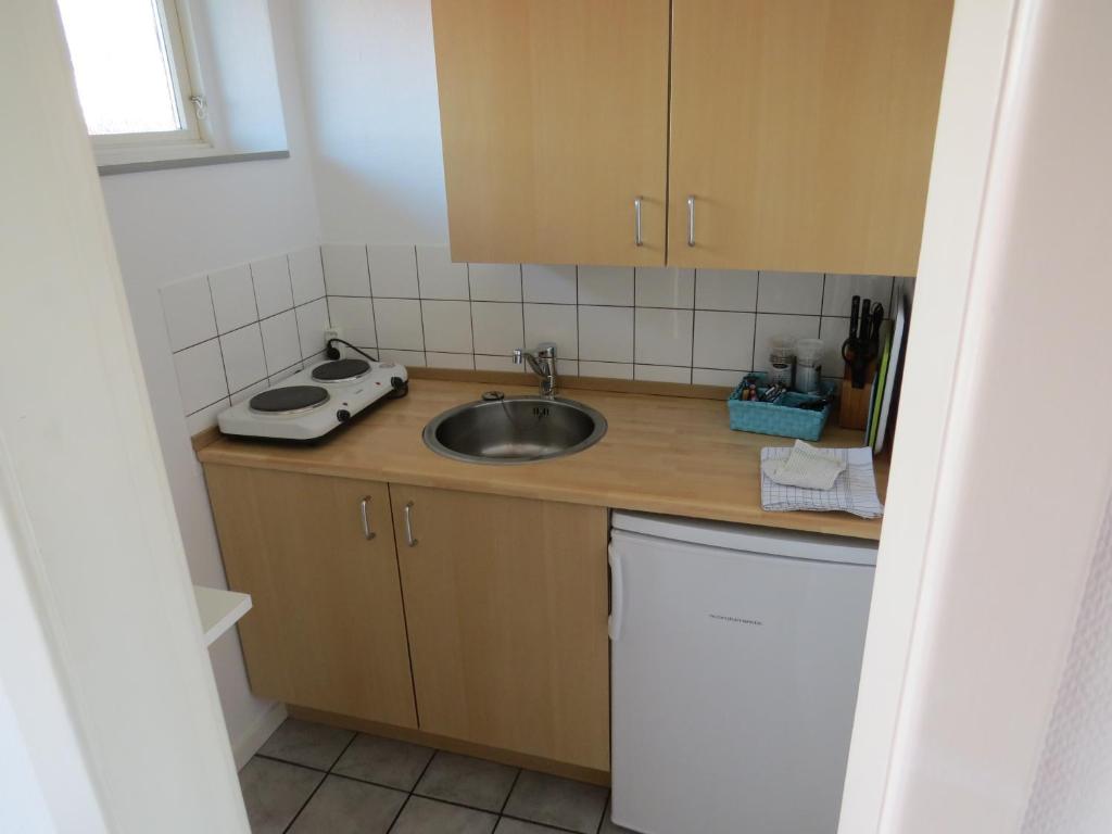Kuchyň nebo kuchyňský kout v ubytování Motel Garni Blåvand