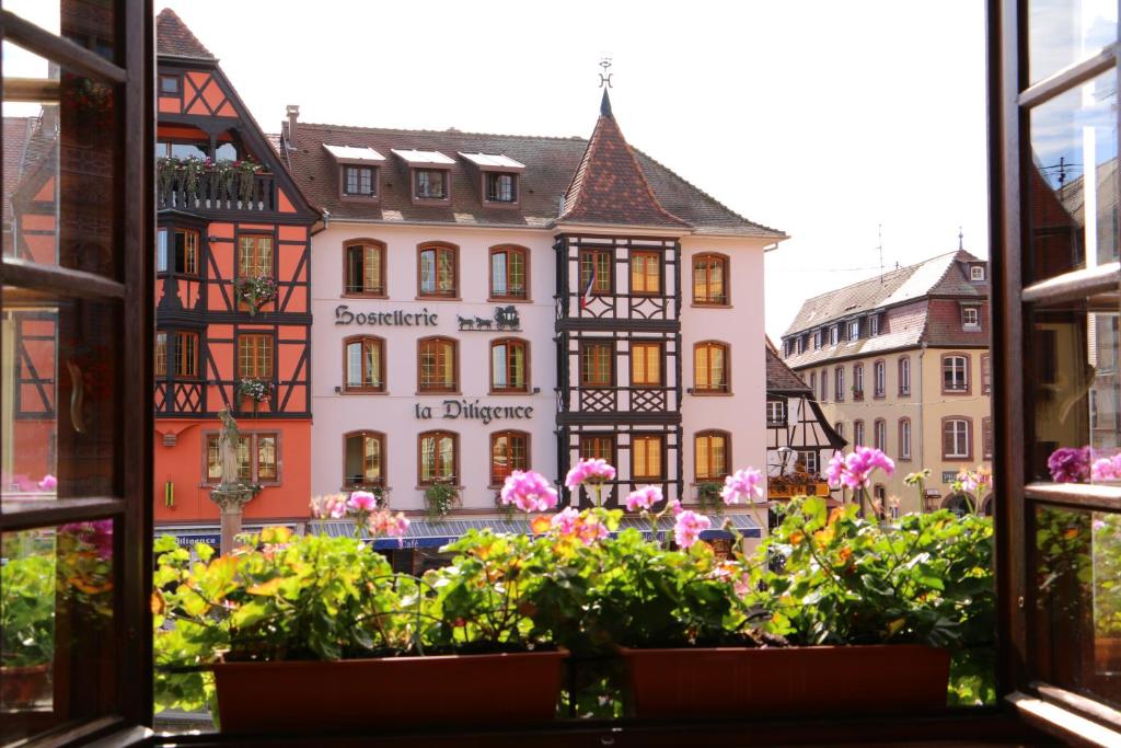 a view from a window of a building at La Fontaine Sainte Odile in Obernai