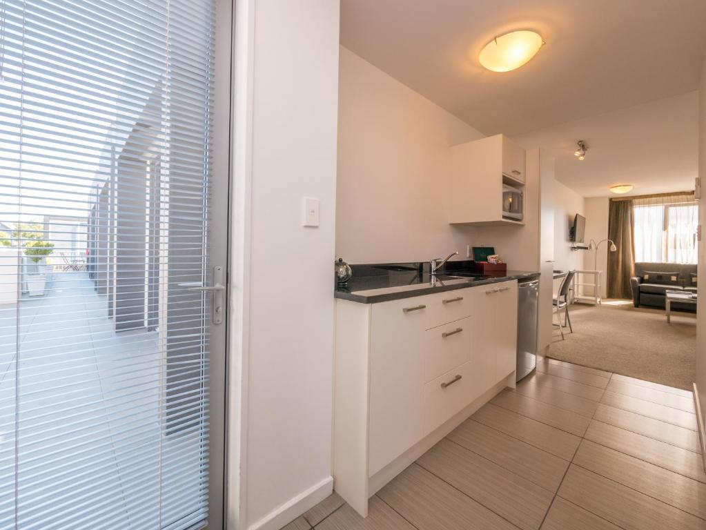 Kuchyň nebo kuchyňský kout v ubytování Bellano Motel Suites