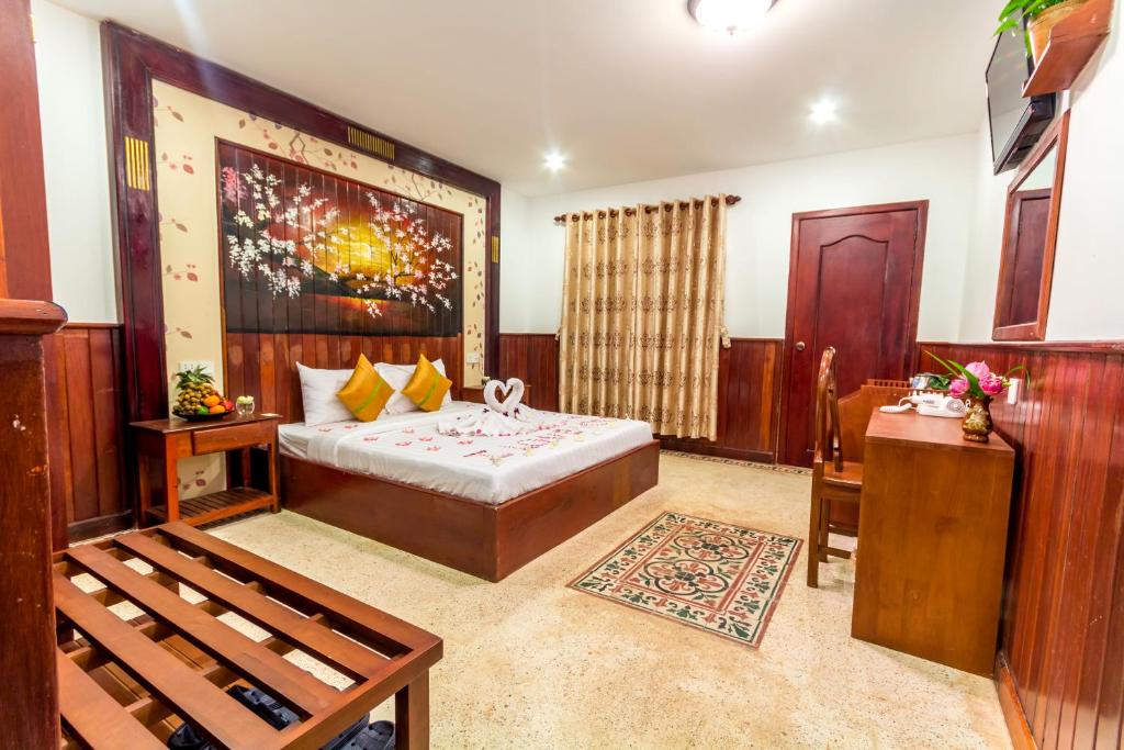 Postel nebo postele na pokoji v ubytování BayStone Resort
