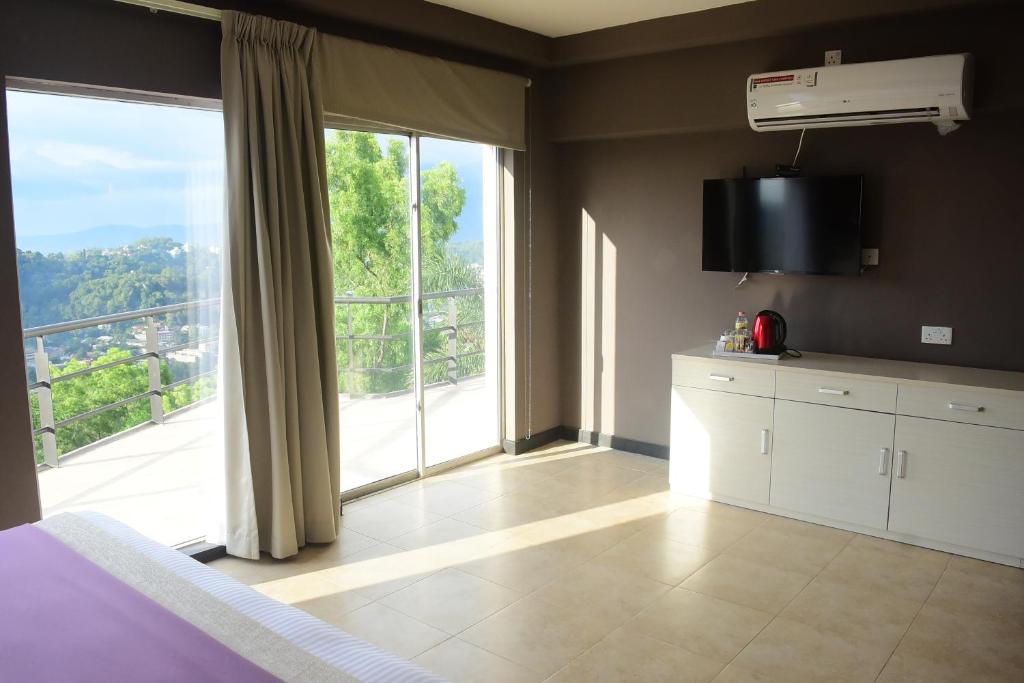 TV a/nebo společenská místnost v ubytování W Residence Kandy