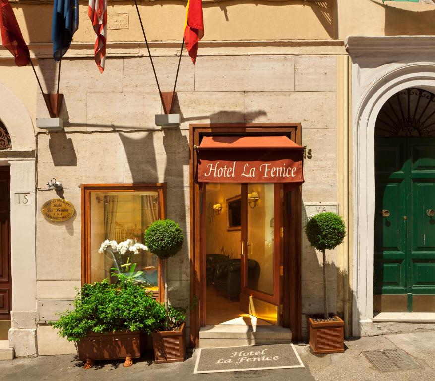 a building with a sign for a hotel la terrano at Hotel La Fenice in Rome