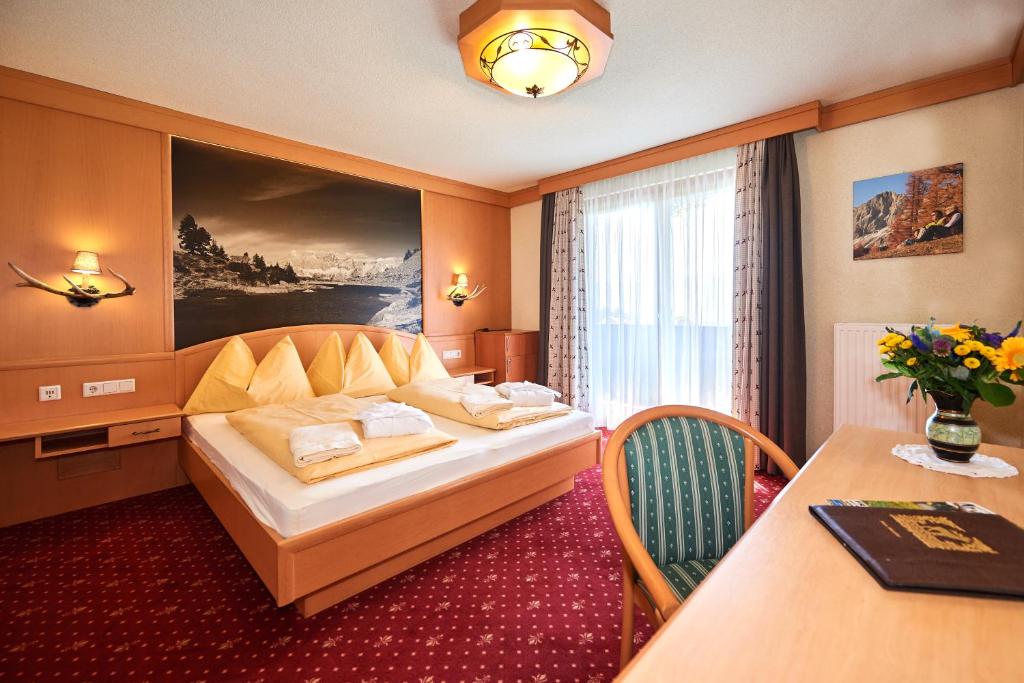 Postel nebo postele na pokoji v ubytování Hotel Jagdhof