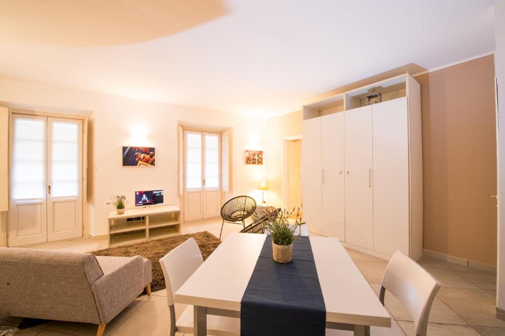 a living room with a table and a couch at ReArduinoIvrea in Ivrea