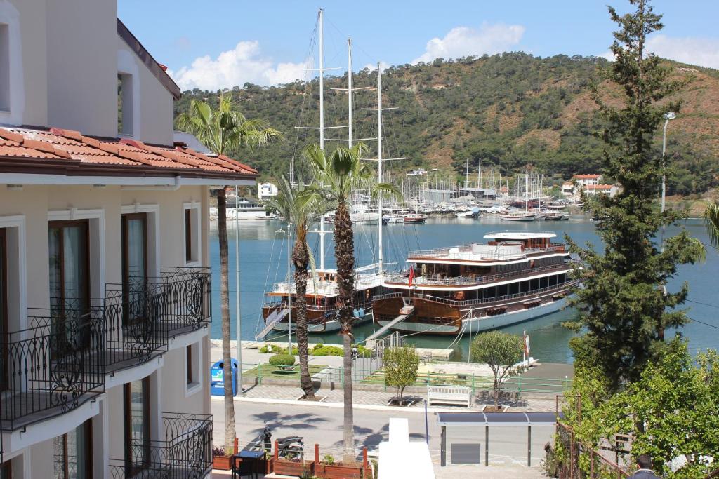 a boat is docked at a marina at Q&S Cennet Life Hotel in Fethiye