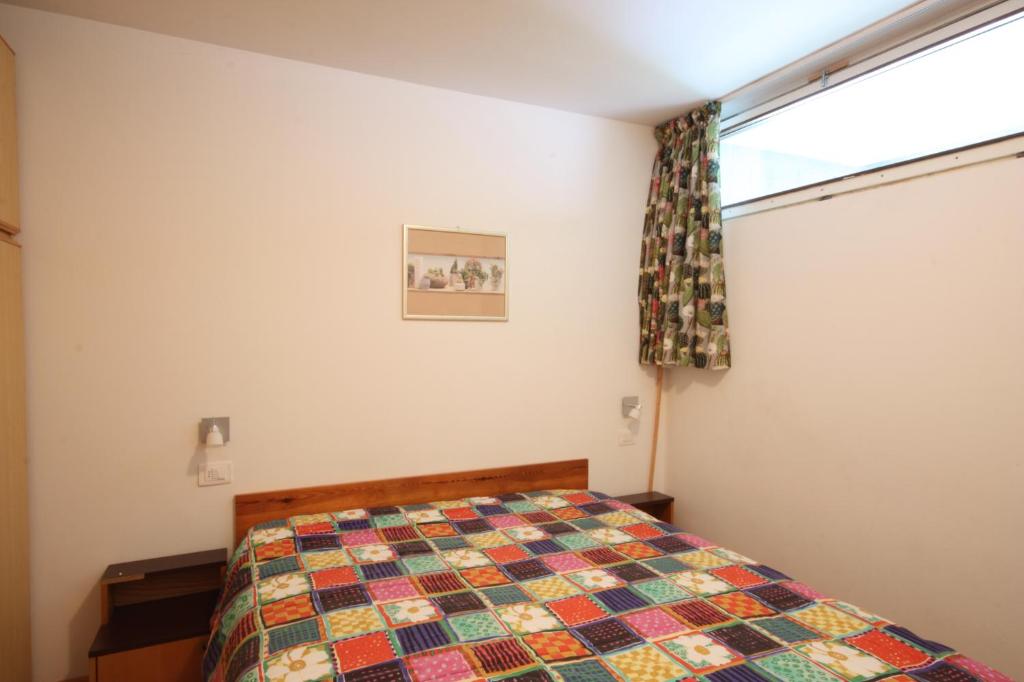 Postel nebo postele na pokoji v ubytování Residence Copai