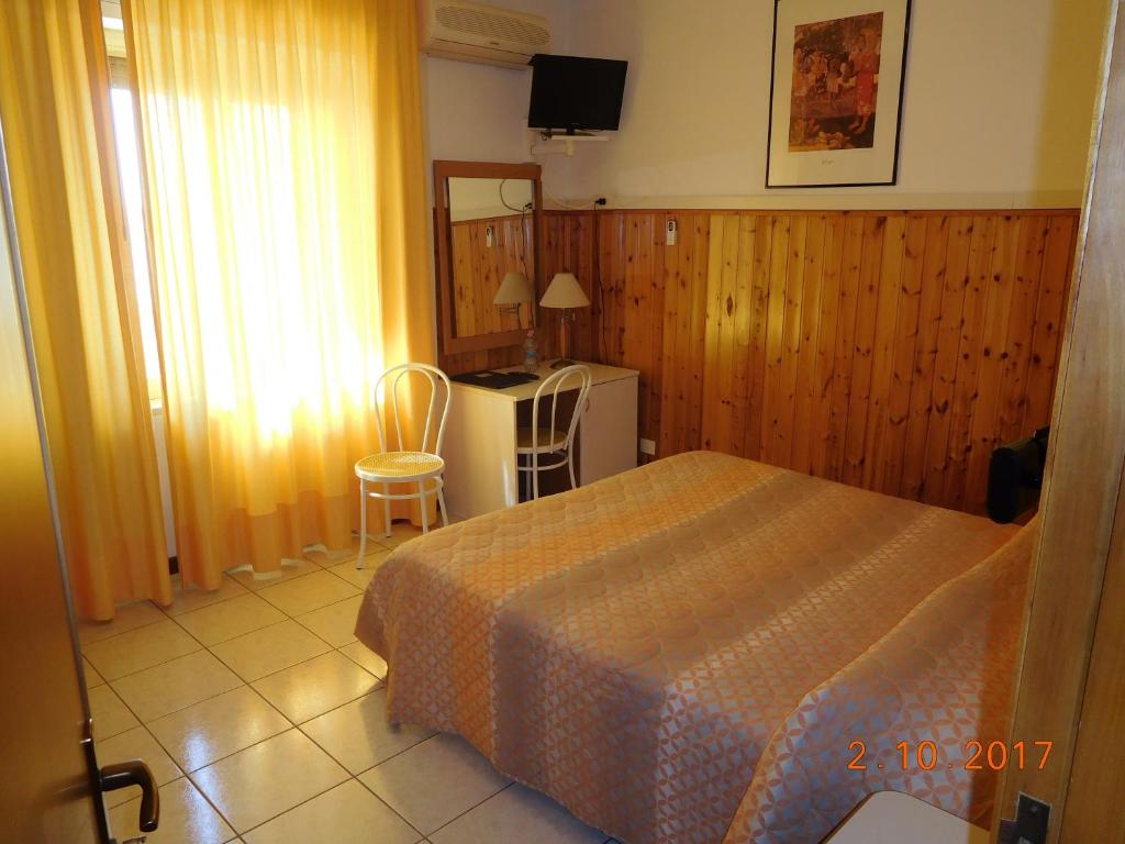 Postel nebo postele na pokoji v ubytování Albergo Ristorante da Settimio