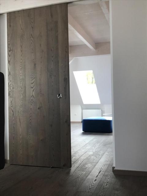 A bed or beds in a room at See-Apartment Weiden