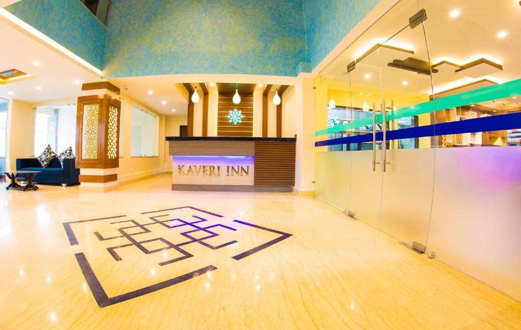 a large room with a lobby with blue ceilings at Kaveri Inn in Kathmandu