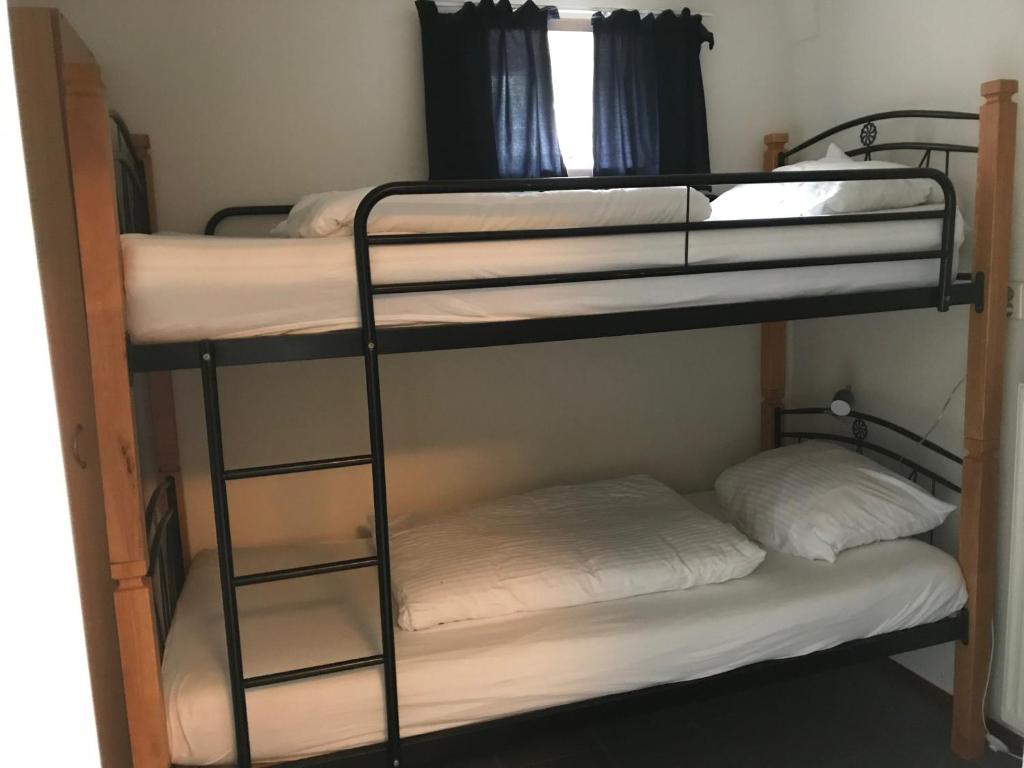 Postel nebo postele na pokoji v ubytování de Goede Ree Huisje 1 en 2