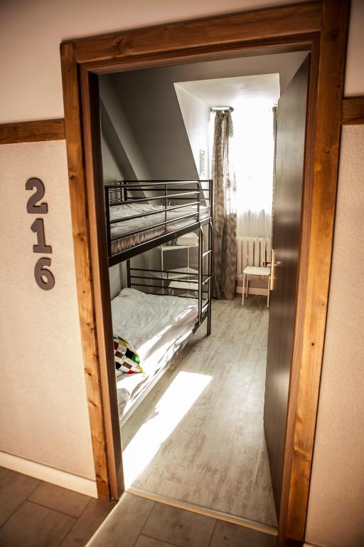 Postel nebo postele na pokoji v ubytování Za Murami Hostel