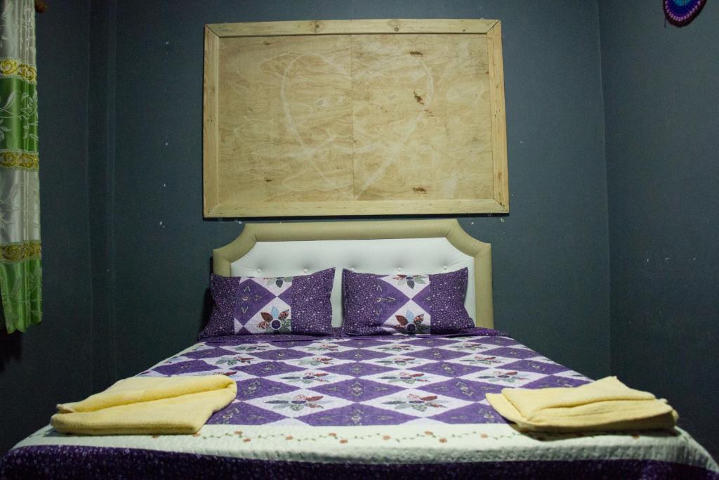 Postel nebo postele na pokoji v ubytování Sook Jai Guest House