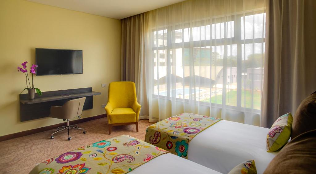 TV a/nebo společenská místnost v ubytování Tamarind Tree Hotel