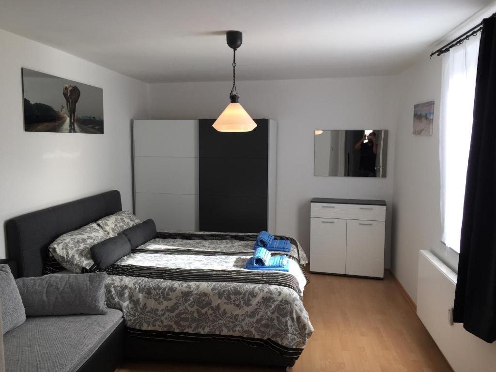 a bedroom with a bed and a couch at Big and Beautiful in Hannover