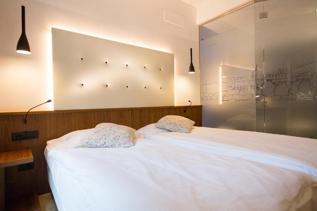 Postel nebo postele na pokoji v ubytování Hotel Pace