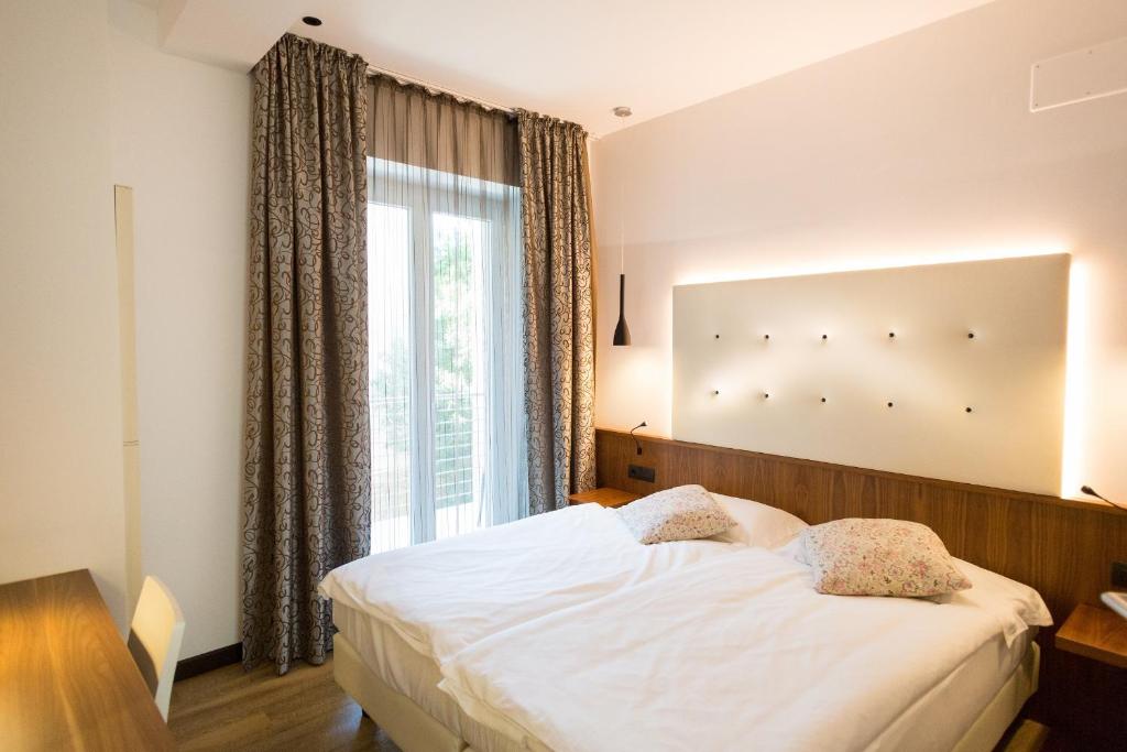 Postel nebo postele na pokoji v ubytování Hotel Pace
