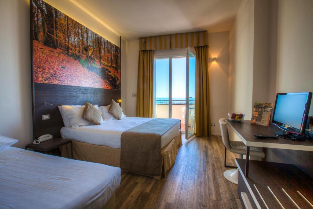 Postel nebo postele na pokoji v ubytování Hotel Life
