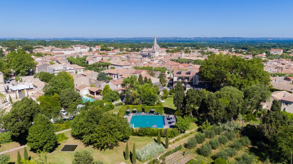 an aerial view of a town with a pool in a park at Hôtel de l'Image in Saint-Rémy-de-Provence
