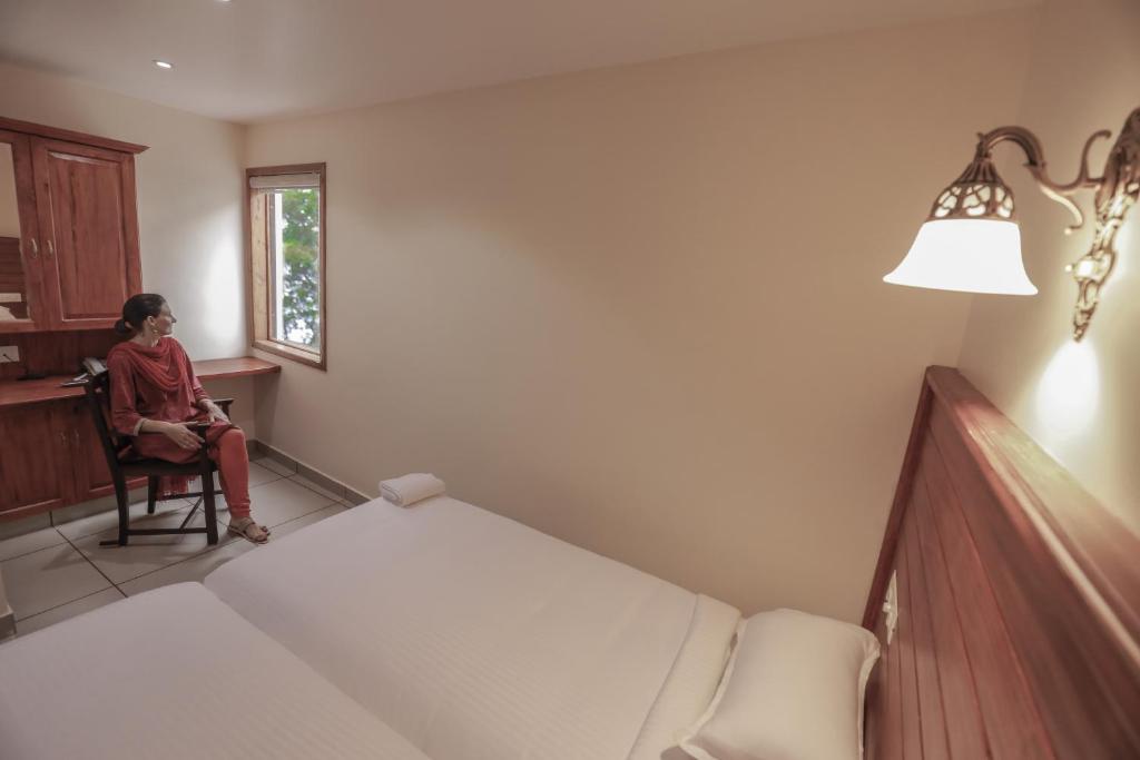 Postel nebo postele na pokoji v ubytování Roses Inn Fortkochi