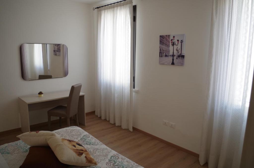 Postel nebo postele na pokoji v ubytování Alla Torre B&B