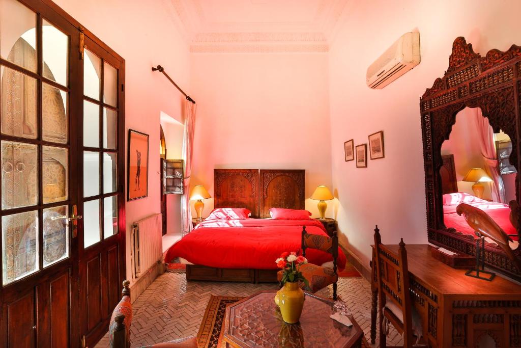 En eller flere senger på et rom på Riad Dar El Assafir
