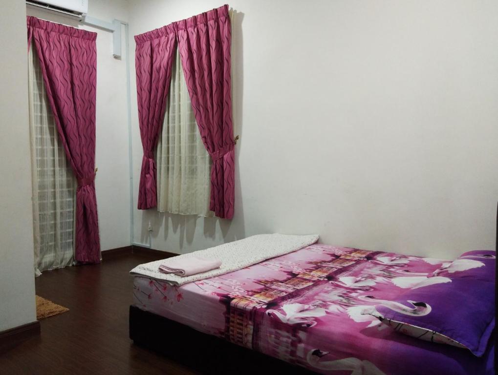 Postel nebo postele na pokoji v ubytování Masayu Putrajaya Homestay