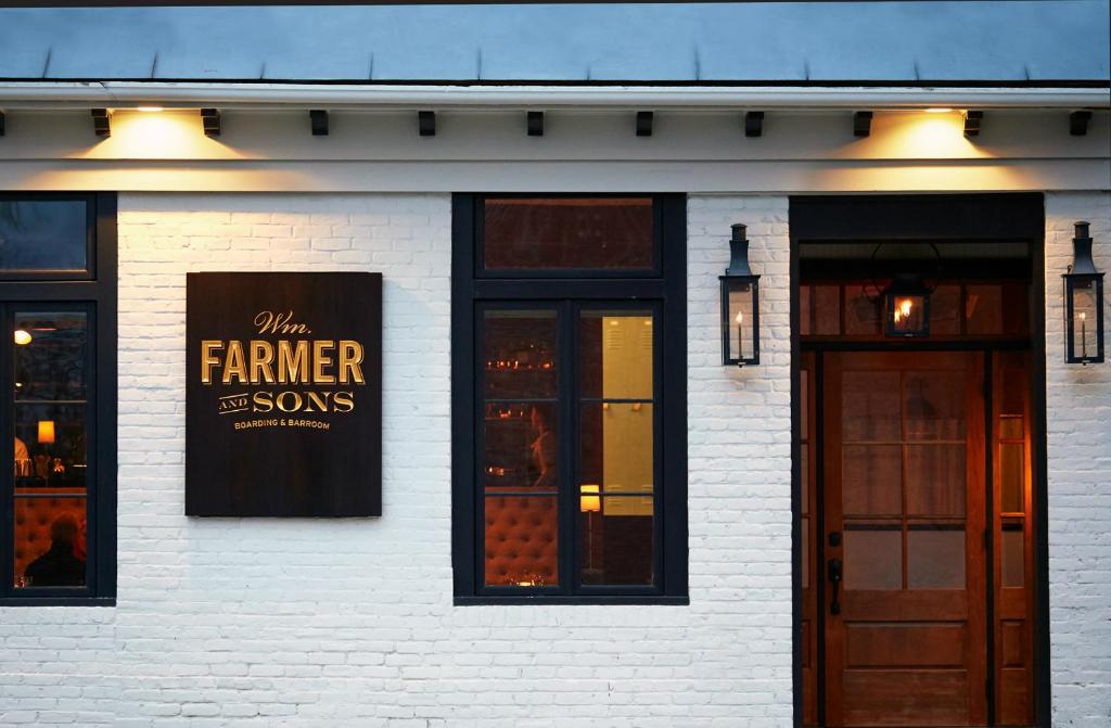 a white brick building with a farmer is sons sign on it at Wm. Farmer and Sons in Hudson