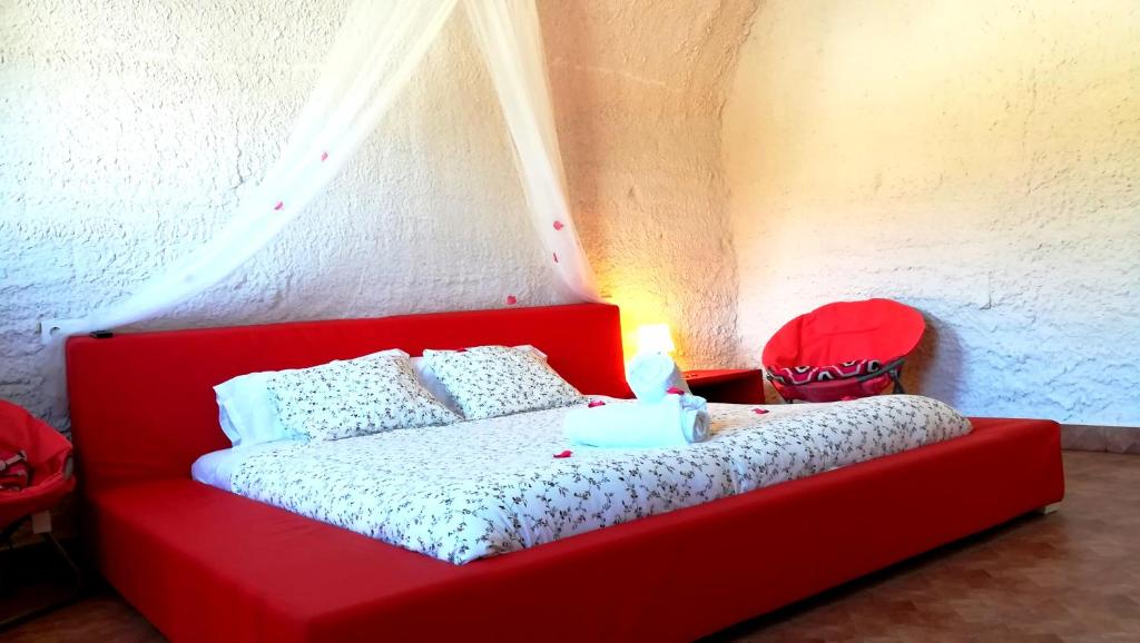 Postel nebo postele na pokoji v ubytování Casas y Cuevas El Solins