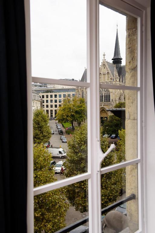 Nespecifikovaný výhled na destinaci Brusel nebo výhled na město při pohledu z penzionu