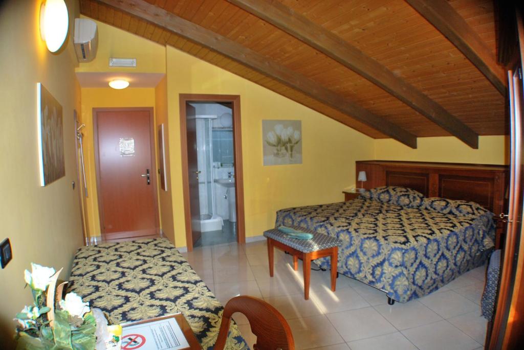 Postel nebo postele na pokoji v ubytování Hotel Belvedere