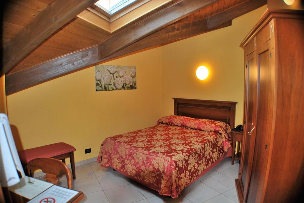 Postel nebo postele na pokoji v ubytování Hotel Belvedere