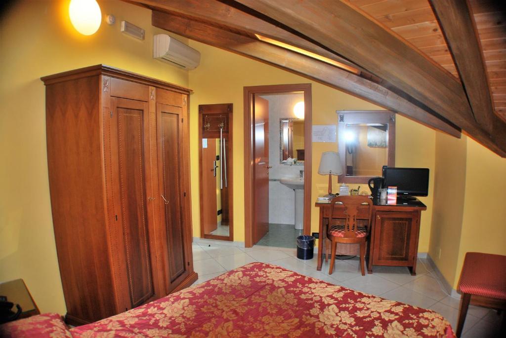 Postel nebo postele na pokoji v ubytování Hotel Belvedere