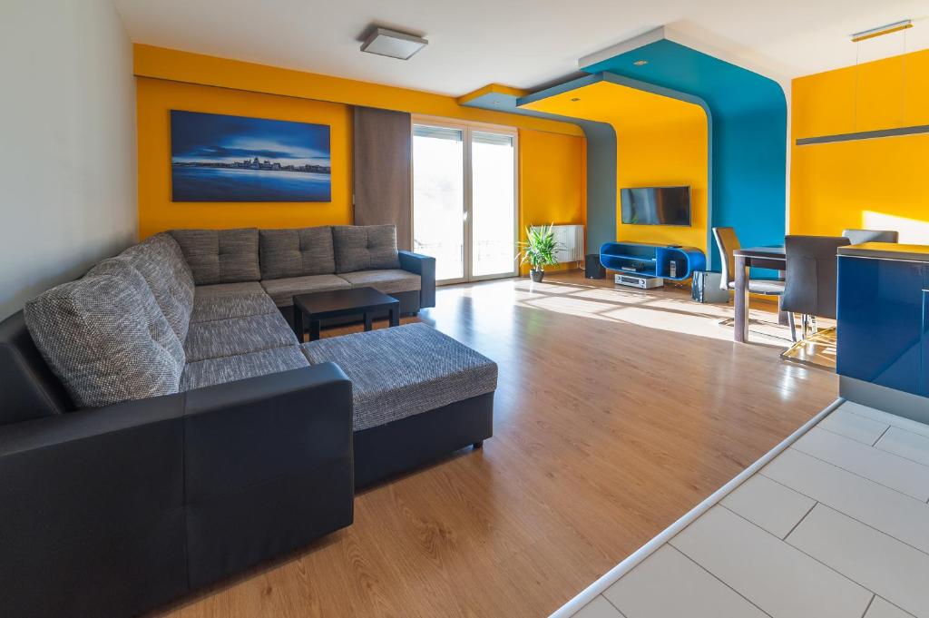 Hotel Budapest Minimal Style - You will love it!, a living room with a couch and a table at Budapest Minimal Style - You will love it! in Budapest