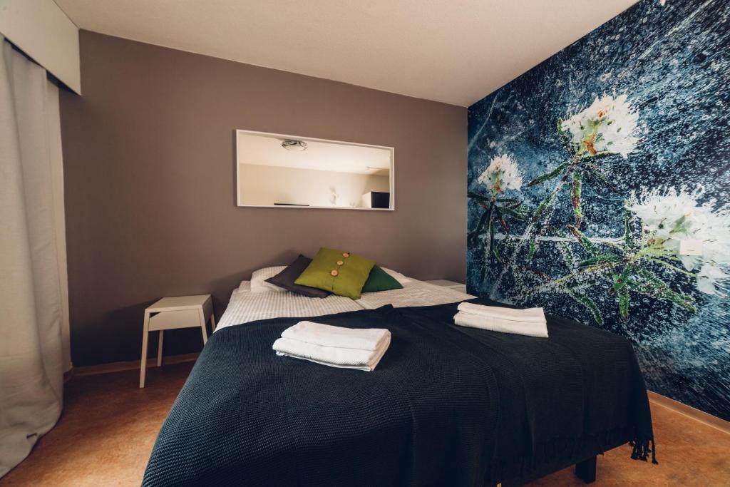 Postel nebo postele na pokoji v ubytování Hotel Kittilä