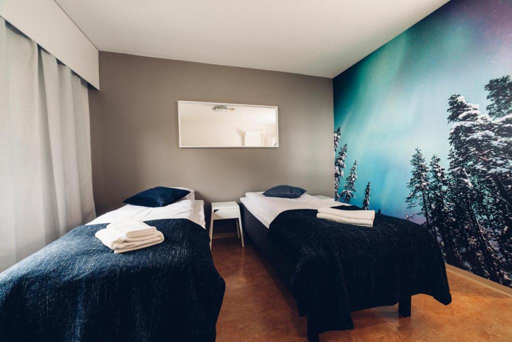 Postel nebo postele na pokoji v ubytování Hotel Kittilä