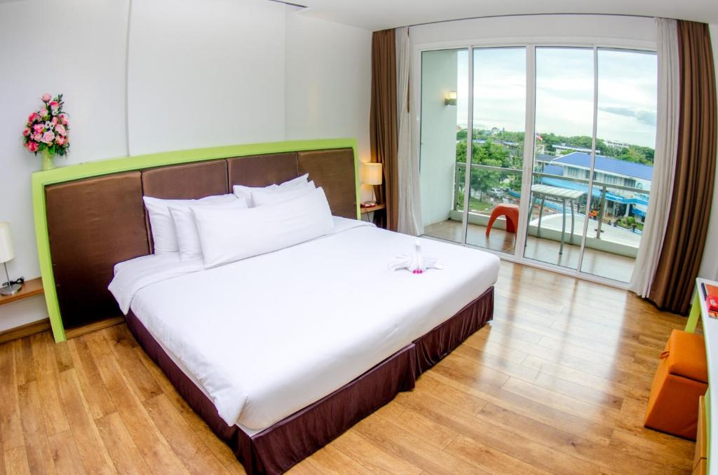 Postel nebo postele na pokoji v ubytování Prajaktra Design Hotel