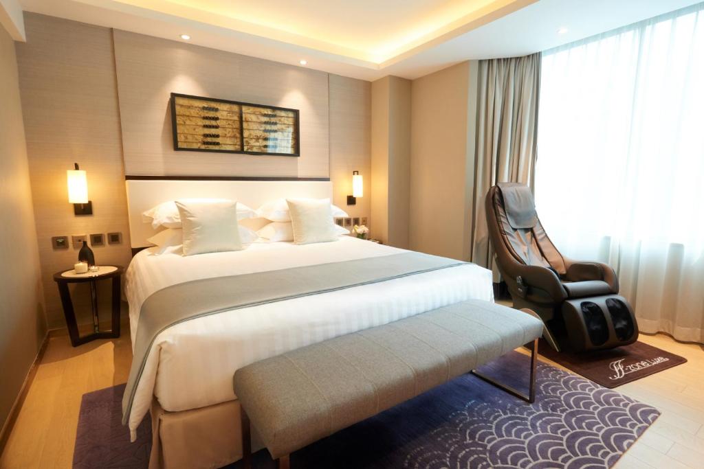Katil atau katil-katil dalam bilik di Wharney Hotel
