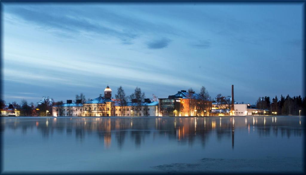 a large body of water surrounded by tall buildings at Hotel Lasaretti in Oulu