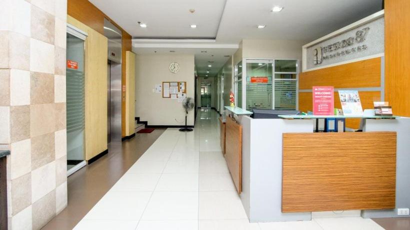 a lobby of a store with a counter and a hallway at The Studio 87 Residences in Manila