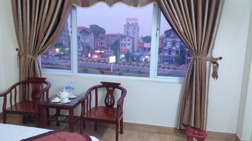 Postel nebo postele na pokoji v ubytování Anh Duong Hotel