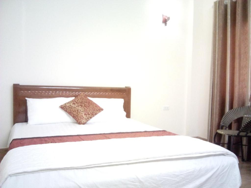 Postel nebo postele na pokoji v ubytování Anh Duong Hotel