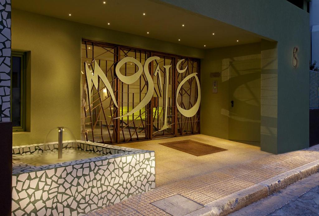 a bathroom with a tub and a painting on the wall at Athens Mosaico Suites & Apartments in Athens