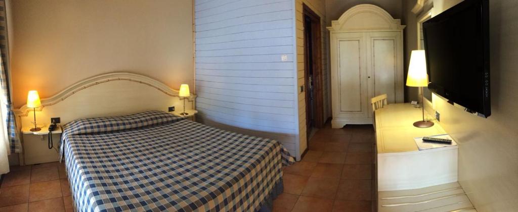 Postel nebo postele na pokoji v ubytování Motel 7 Laghi